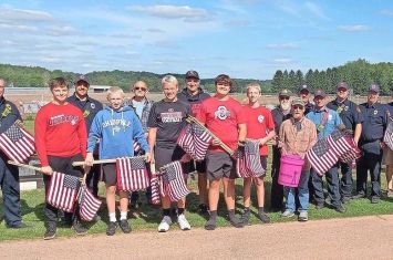 Volunteers place flags